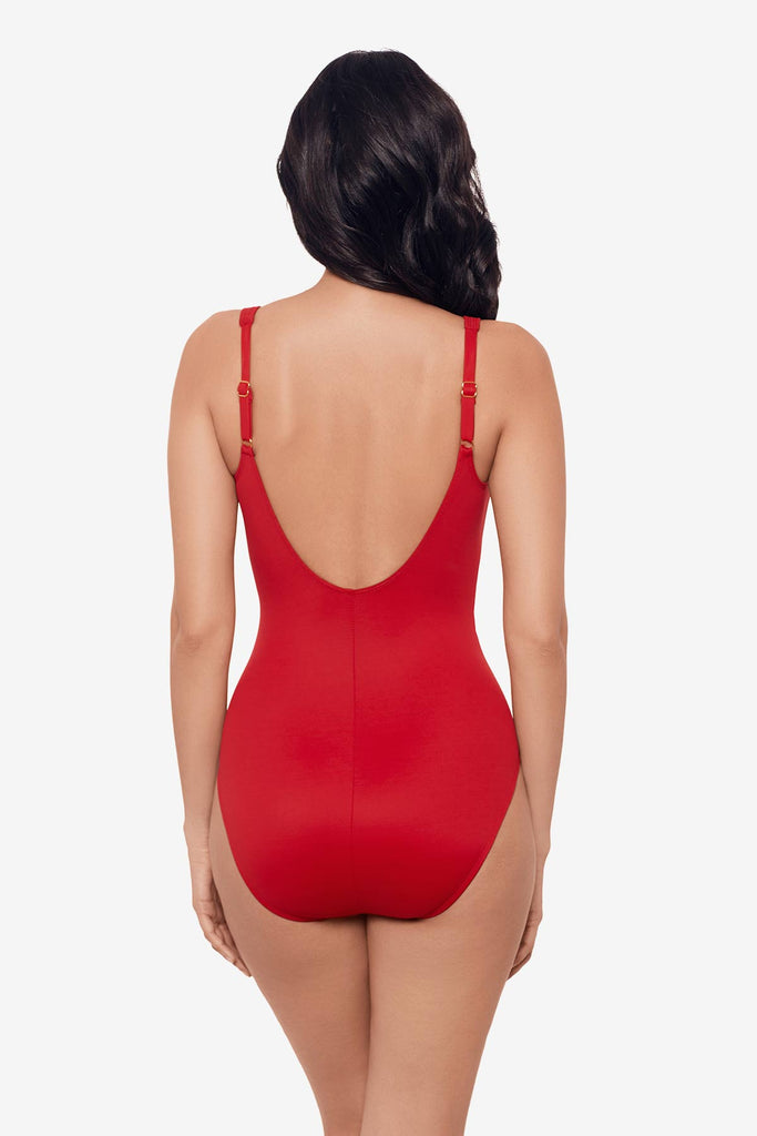 Woman facing away wearing a cayenne red one-piece swimsuit 