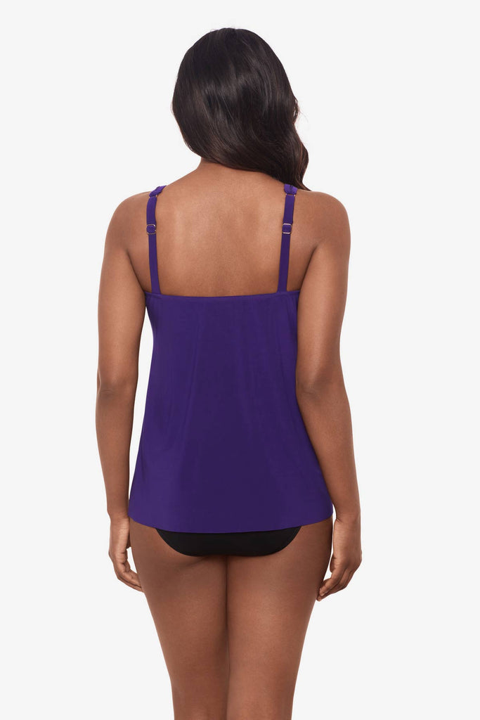 Woman facing away wearing a mulberry purple tankini top