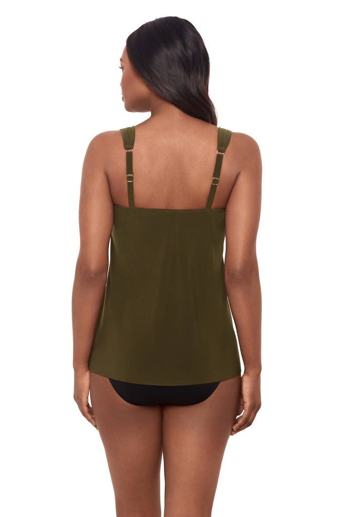 Woman facing away wearing a nori green tankini top 