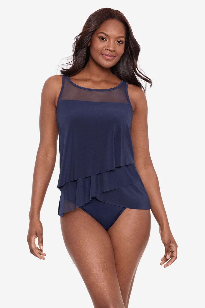 Woman wearing a midnight blue tankini top with a mesh fabric neckline