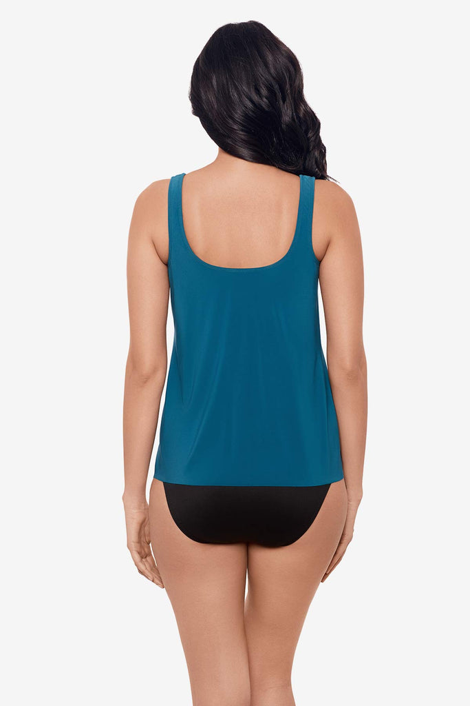 Woman facing away Woman wearing an aegean blue tankini top 