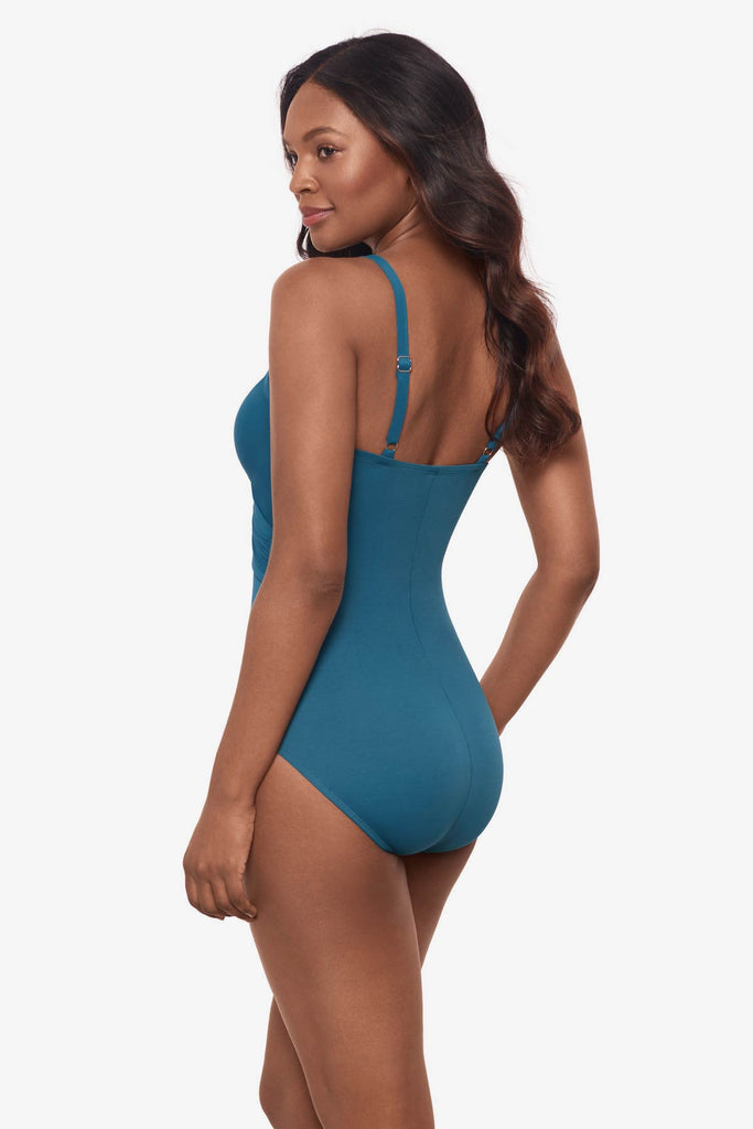 Woman looking left to show one-piece swimsuit detail