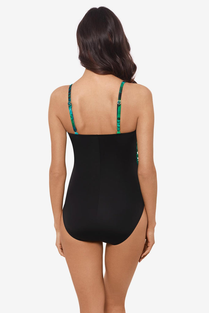 Woman facing away Woman wearing multicolor one-piece swimsuit 