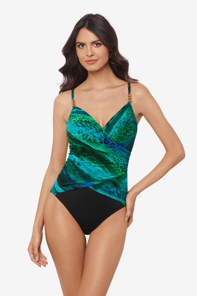 Woman wearing multicolor one-piece swimsuit with details on the straps