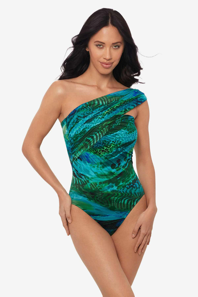 Woman wearing a multicolor one-piece swimsuit with an asymmetrical cut