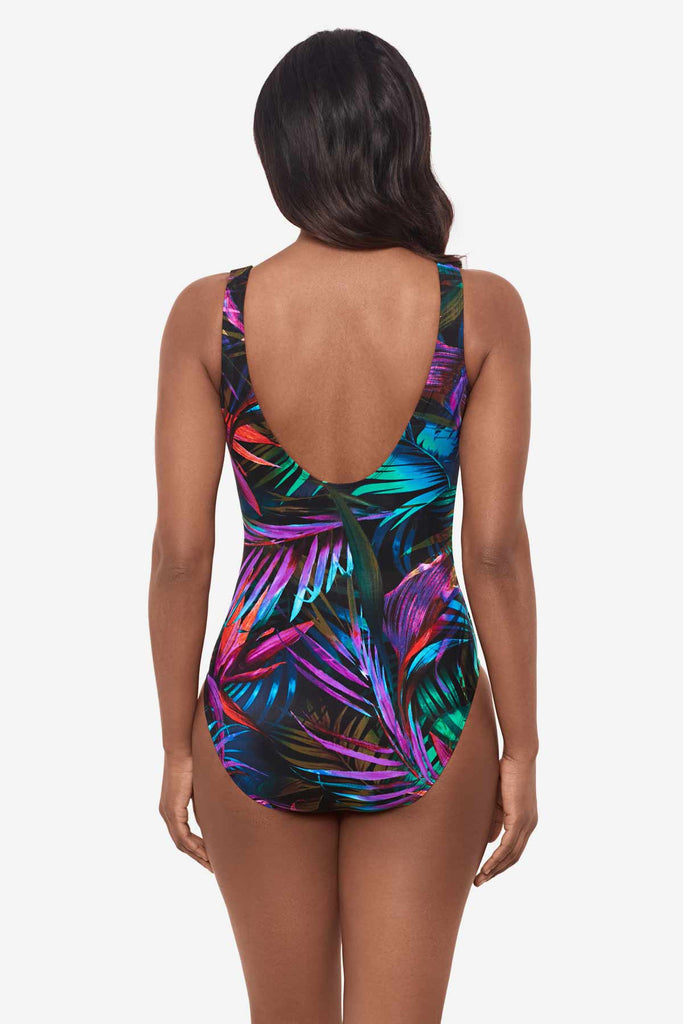 Woman facing awaywearing a multicolor one-piece swimsuit 