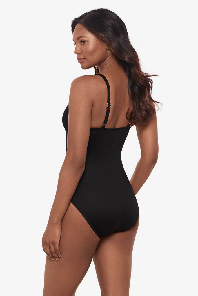 Woman turned left to show the one-piece swimsuit detail