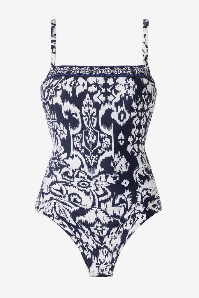 One-piece blue and white swimsuit with an abstract floral print