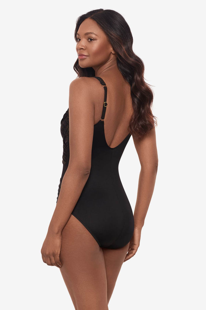 Woman turned left showing off the one-piece side details