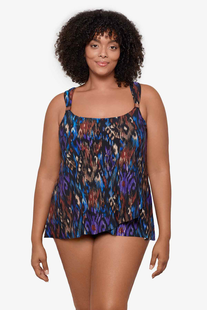 Woman wearing a multicolor tankini top with details on the straps